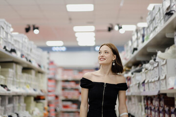 woman in clothing and shoe store shopping