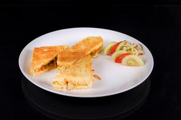 Sandwich with ham, cheese and vegetables isolated on a white background