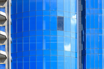 Broken window in a typical glass city skyscraper. Accident concept. Background with copy space