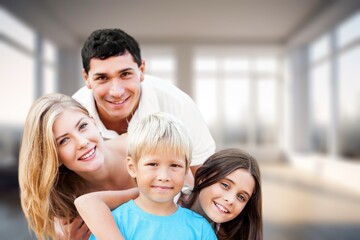 Obraz premium Portraif Of Happy Parents Posing With child At Home,