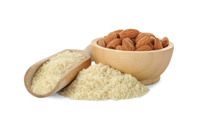 Pile of fresh almond flour, scoop and bowl with nuts isolated on white
