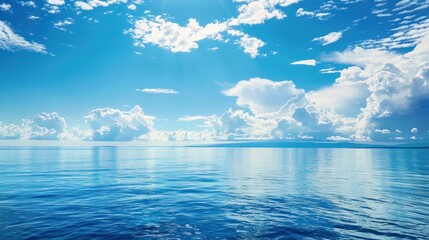 The blue ocean is calm water and the sun is shining brightly