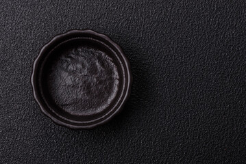 Beautiful empty white ceramic gravy boat on a concrete background