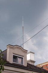 Lightning rod on a roof in a rainy day