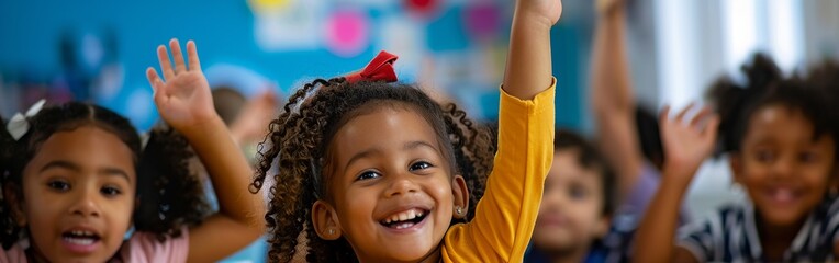 Happy children with raised hands enthusiastically participate in a classroom activity, showcasing engagement and learning.