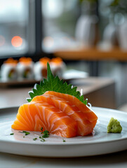 Close-up of salmon sashimi on a plate with garnishes.