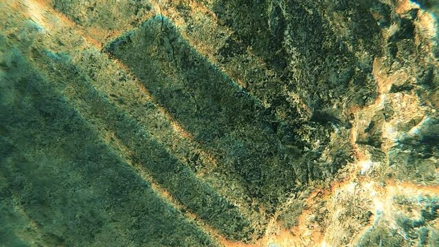 underwater sunlight on rocks 