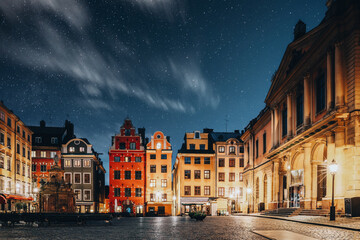 Naklejka premium Stockholm, Sweden. Famous Old Colorful Houses, Swedish Academy and Nobel Museum In Old Square Stortorget In Gamla Stan. Famous Landmarks And Popular Place.