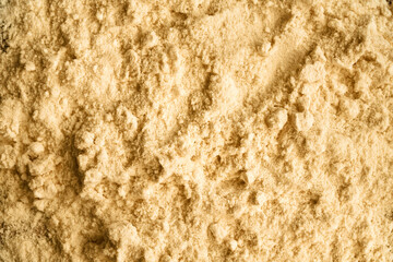 Background made of whey protein powder - healthy nutritional supplement