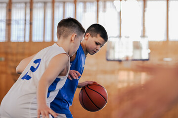 Close-up of kids with blurred faces playing basketball