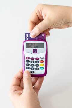 Hands using AIB (Allied Irish Banks) card reader for internet banking access