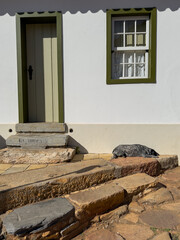 Rustic Doorway With Stone Steps and a Resting Dog