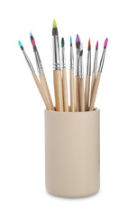 Wooden brushes with colorful paints in holder isolated on white