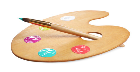 Wooden artist's palette with samples of paints and brush isolated on white