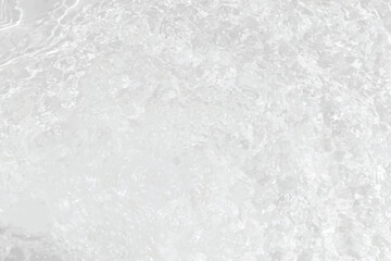 Obraz premium White water with ripples on the surface. Defocus blurred transparent white colored clear calm water surface texture with splashes and bubbles. Water waves with shining pattern texture background.