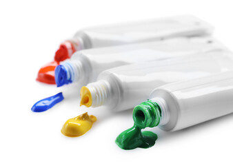 Many tubes with colorful paints isolated on white