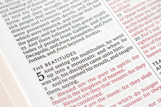 Christian beatitudes verses in open holy bible book. Close-up. Jesus Christ's blessings, studying Sermon on the Mount, new testament gospel message, biblical concept.