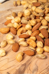 Mixed nuts on wooden background