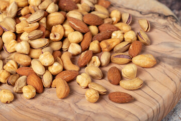 Mixed nuts on wooden background. Close up