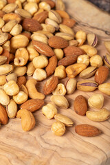 Mixed nuts on wooden background. Close up