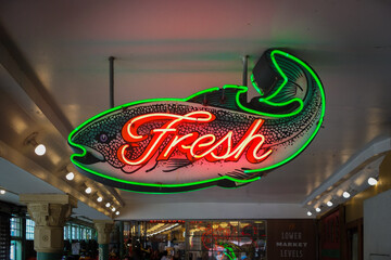 A Neon Sign For Fresh Fish Shop at the Public Market Street Fair - Powered by Adobe