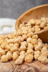 Hazelnuts on wood background. Roasted hazelnuts in a bowl