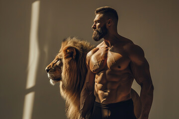 muscular athletic blond man with a beard and tattoos with lion, soft studio lighting on gray