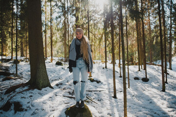 person walking in winter forest