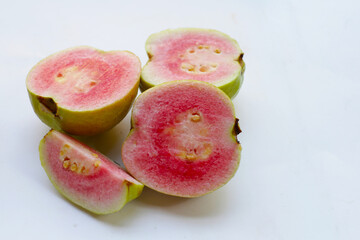 Fresh pink guava on white background.