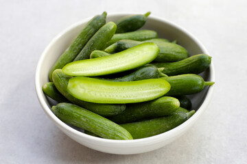 Mini cucumbers on white background.