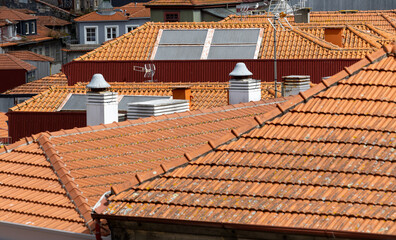 Roofing, tiles on the roof of a building, traditional architecture, texture photo. Portugal