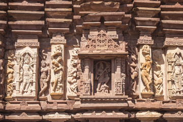Ancient Indian Menal Shiv Temple featuring intricate carvings and vibrant floral foreground, Rajasthan, India