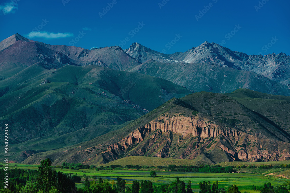 Sticker Picturesque mountain valley on summer day