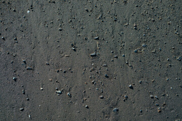 Black sand on beach texture or background