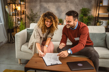 Woman sign insurance policy, contract to man financial adviser at home
