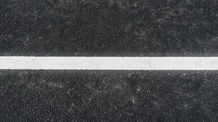 Fototapeta premium top view of black asphalt with one single white paint mark texture, background for overlay