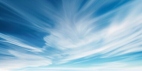 Majestic sky with dynamic clouds. Breathtaking visual of ethereal white clouds streaked across a vibrant blue sky, conveying freedom and tranquility. Perfect for nature, weather, and travel content.