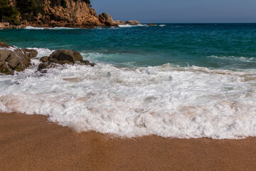 beach in Cala Sa Boadella Bay, Costa Brava, Lloret de Mar, Catalonia, Spain. Beautiful seascape. huge waves