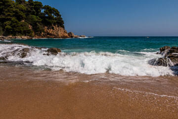 beach in Cala Sa Boadella Bay, Costa Brava, Lloret de Mar, Catalonia, Spain. Beautiful seascape. huge waves