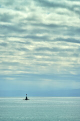 Fototapeta premium Oak Bay Salish Sea Marker. A navigation marker under a dramatic sky near Victoria. British Columbia, Canada.