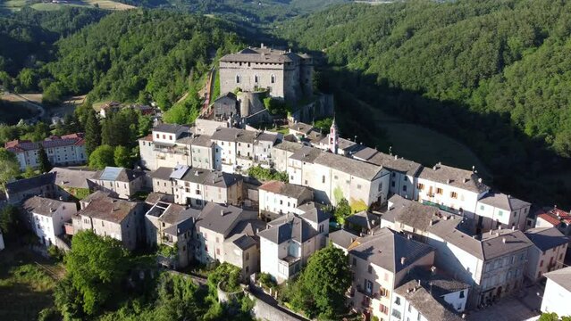 Aerial view of the small village of Compiano and the castle of Compiano. Compiano, Parma, Italy