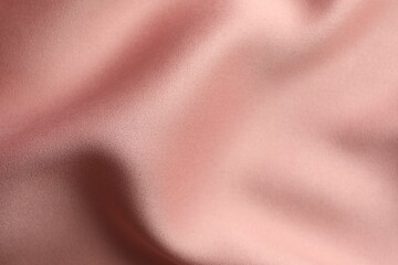 Texture of pink silk fabric as background, closeup