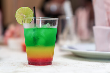 A Peruvian rainbow cocktail on the table. In Peru, this cocktail is called 