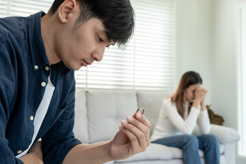 Divorce. Man remove married ring. Couples desperate and disappointed after marriage. Husband wife sad, upset and frustrated after quarrels conflict. distrust, love problems, betrayals, family, lover