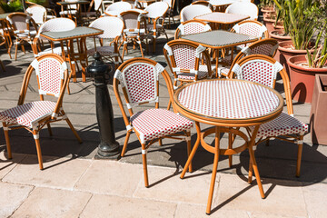 Outdoor cafe terrace with table and chairs. Patio furniture for outdoor use