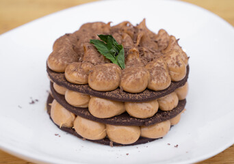 Chocotorta. Closeup view of a cake made with chocolate cookies and dulce de leche cream, in a white dish.