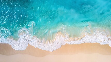 Obraz premium Aerial view of tide blue sea water and sandy beach