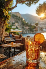 A chilled iced tea garnished with lemon slice, sitting on a wooden table with a cozy coastal backdrop as the sun sets