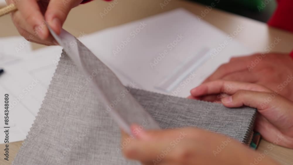 Poster slow motion hand closeup architect and interior designer presenting textile material and color from 