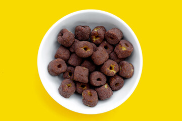 Corn snack chocolate flavor on yellow background.